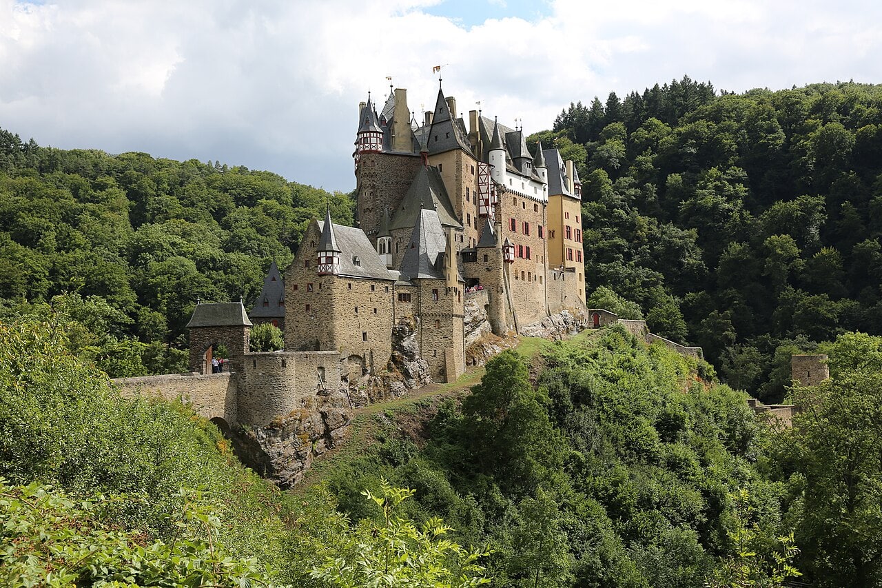 Burg Eltz rising above the forest of the Moselle Valley, Germany