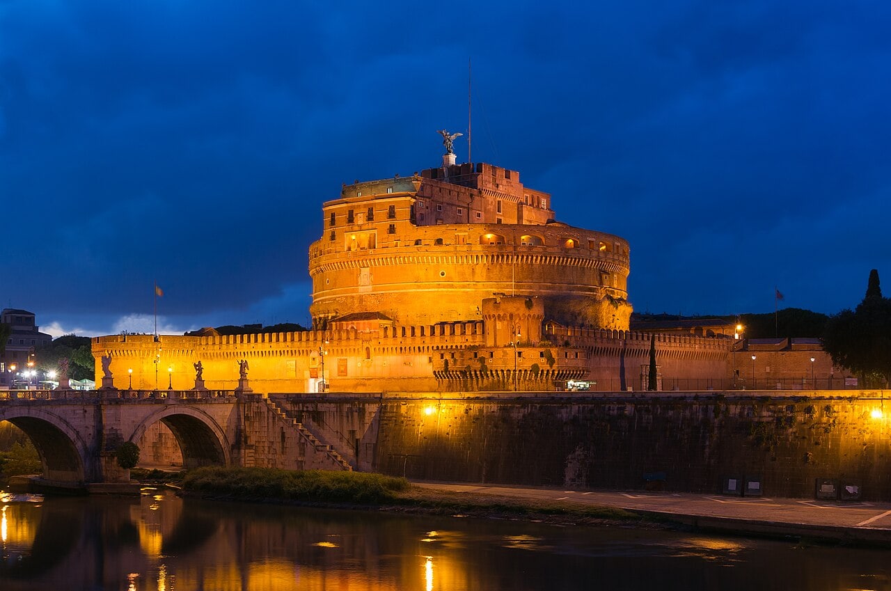 Castel Sant’Angelo at dusk reflected in the Tiber River, Rome, Italy