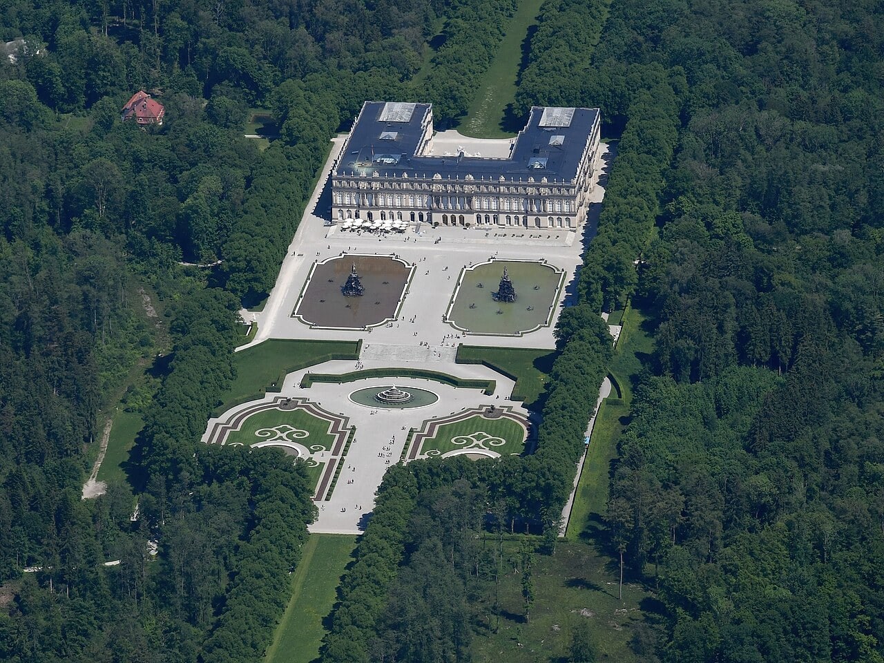 Best Castles in Bavaria 6 Aerial view of Herrenchiemsee New Palace with its formal gardens, canal, and the Chiemsee beyond