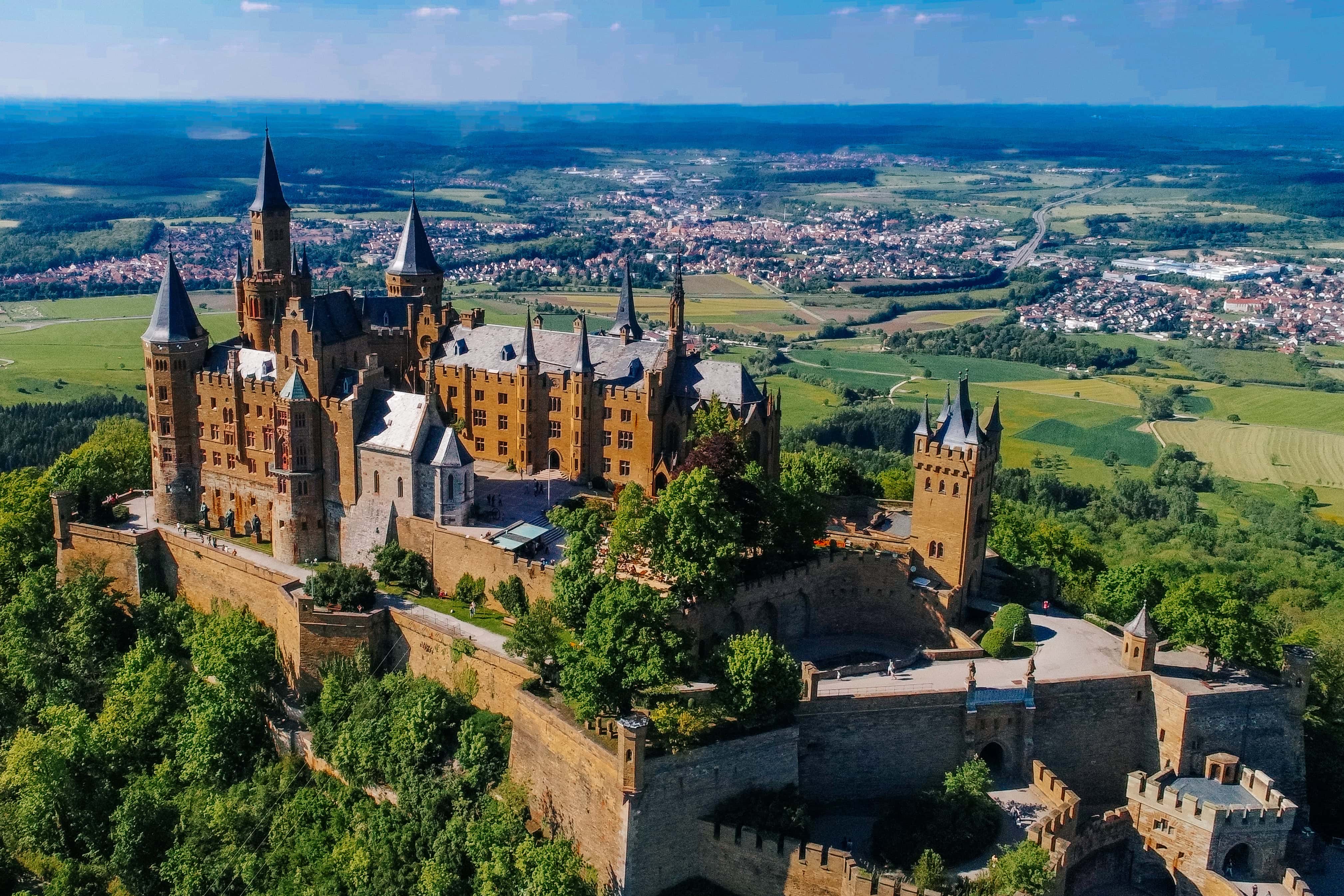 Hohenzollern Castle 2 Aerial view of Hohenzollern Castle from above showing the full bastion ring, inner castle complex, and the town of Hechingen visible on the plain below