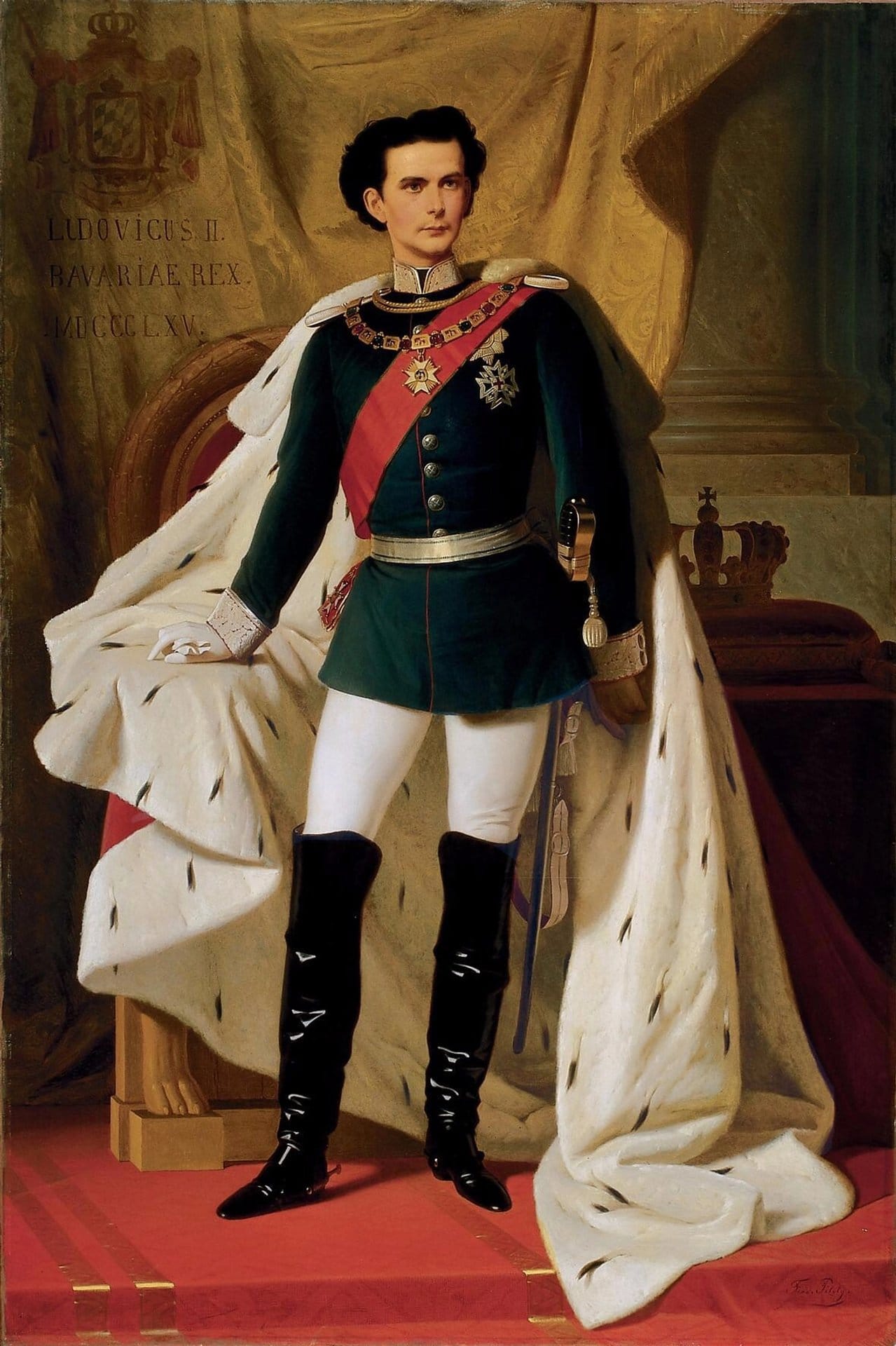 The Castles of King Ludwig II 2 Full-length painted portrait of a young dark-haired Ludwig II of Bavaria standing in coronation robes, wearing an ermine-trimmed white cape and dark blue military uniform with red sash and decorations, with a throne and crown beside him