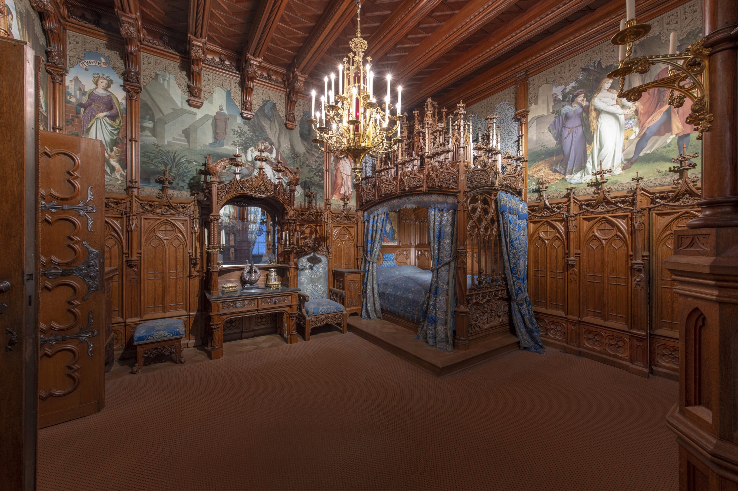 Neuschwanstein Castle 7 King Ludwig II's bedroom at Neuschwanstein Castle featuring the elaborately carved Gothic oak four-poster bed and richly painted walls depicting the Tristan and Isolde legend