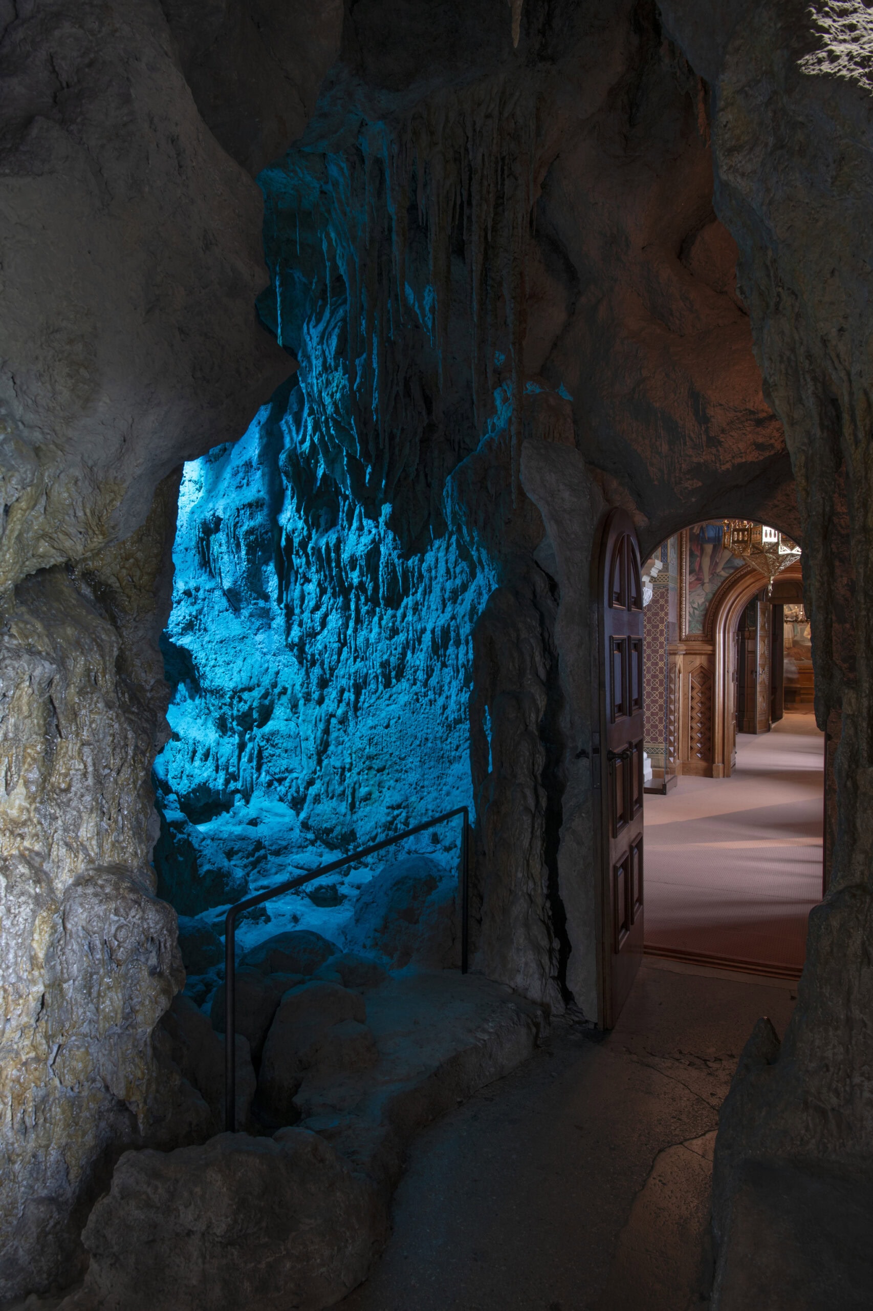 Neuschwanstein Castle 8 Artificial stalactite grotto inside Neuschwanstein Castle with blue-tinted lighting illuminating rocky arch passages between the Bedroom and the Study