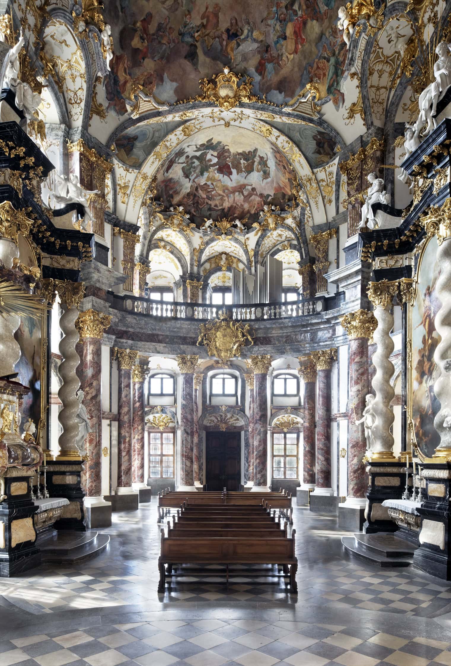 Würzburg Residence 2 Interior of the Hofkirche at the Würzburg Residence showing the gilt stuccowork, black marble columns, and ceiling frescoes.