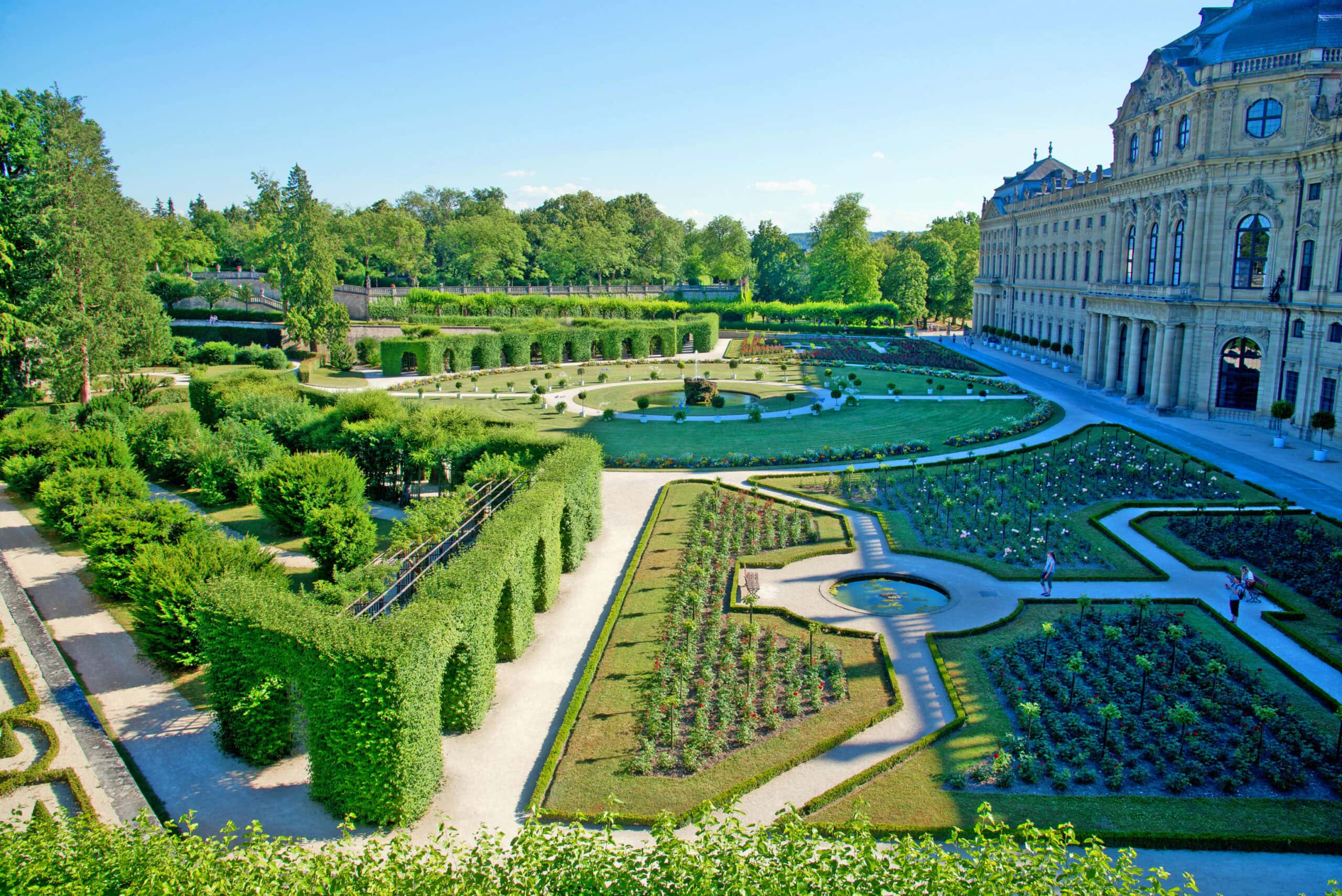 Würzburg Residence 5 Aerial summer view of the Hofgarten at the Würzburg Residence showing the formal Baroque parterres, hedge arbours, and the Residence's south wing on the right.