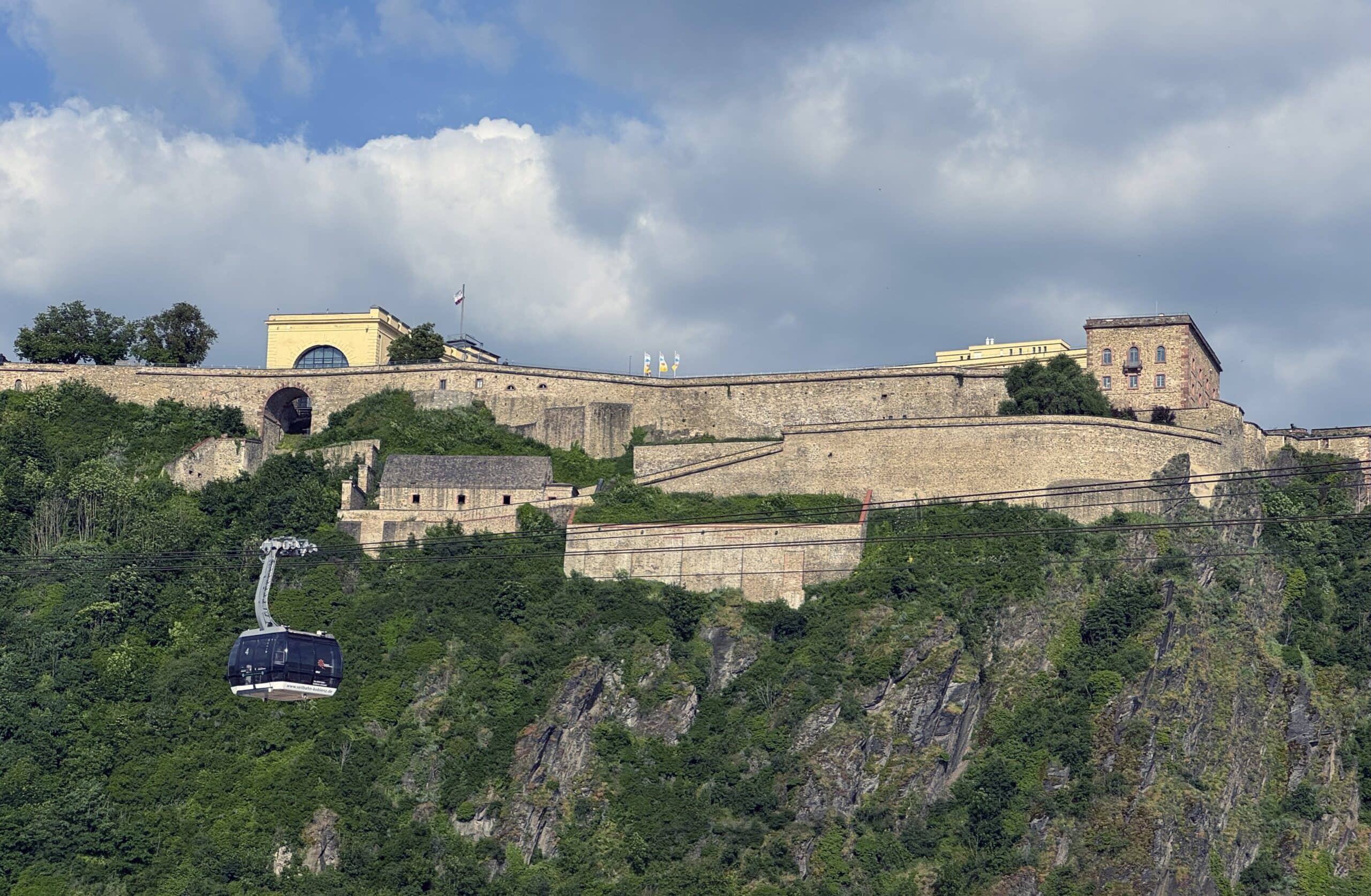 Ehrenbreitstein Fortress 6 The Seilbahn Koblenz cable car descending the cliff in front of Festung Ehrenbreitstein, June 2024.