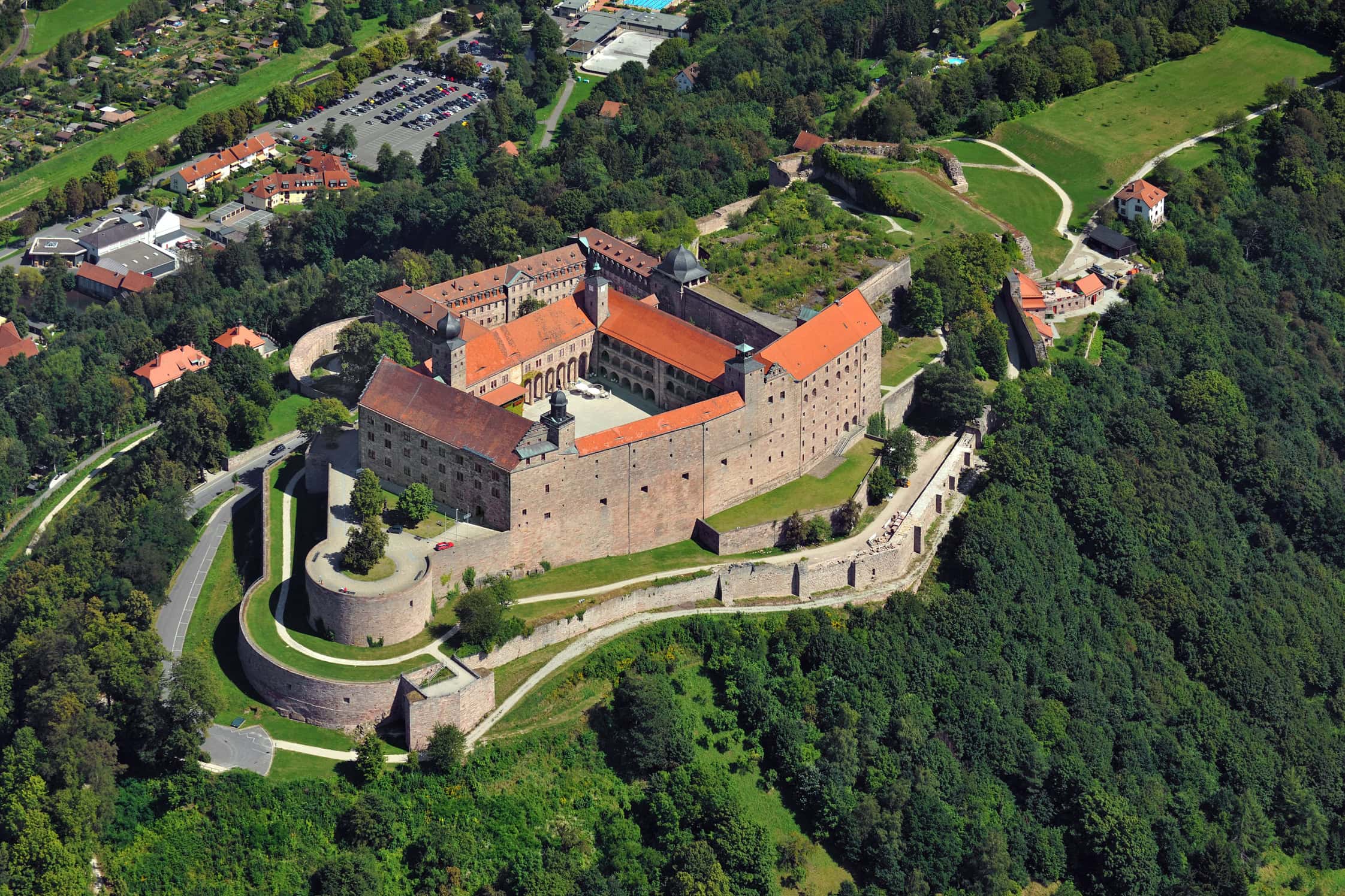 Castles of Franconia: Seven Princely Seats Across the Region 5 Aerial view of Plassenburg Fortress on its sandstone spur above Kulmbach in Upper Franconia.