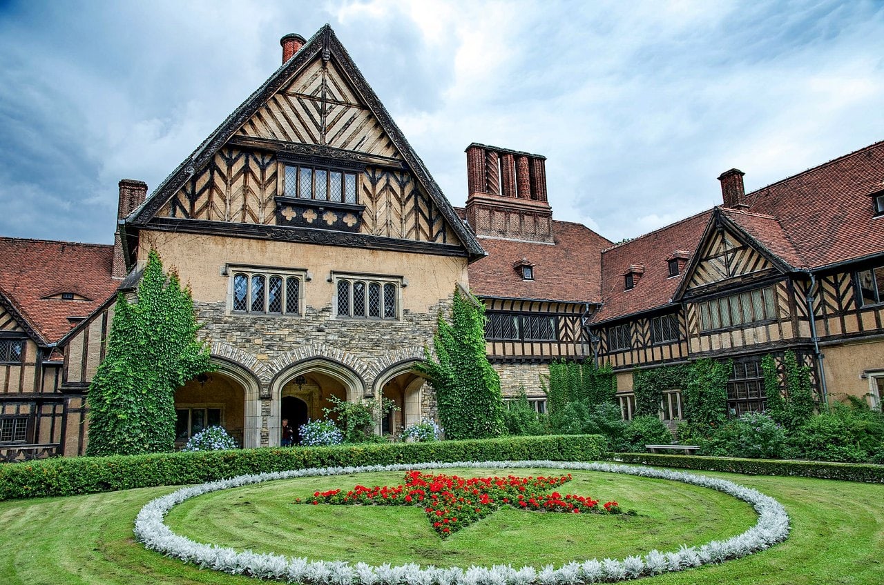 Cecilienhof Palace 1 The Ehrenhof courtyard of Cecilienhof Palace with the Soviet-planted red-star flower bed and half-timbered gable