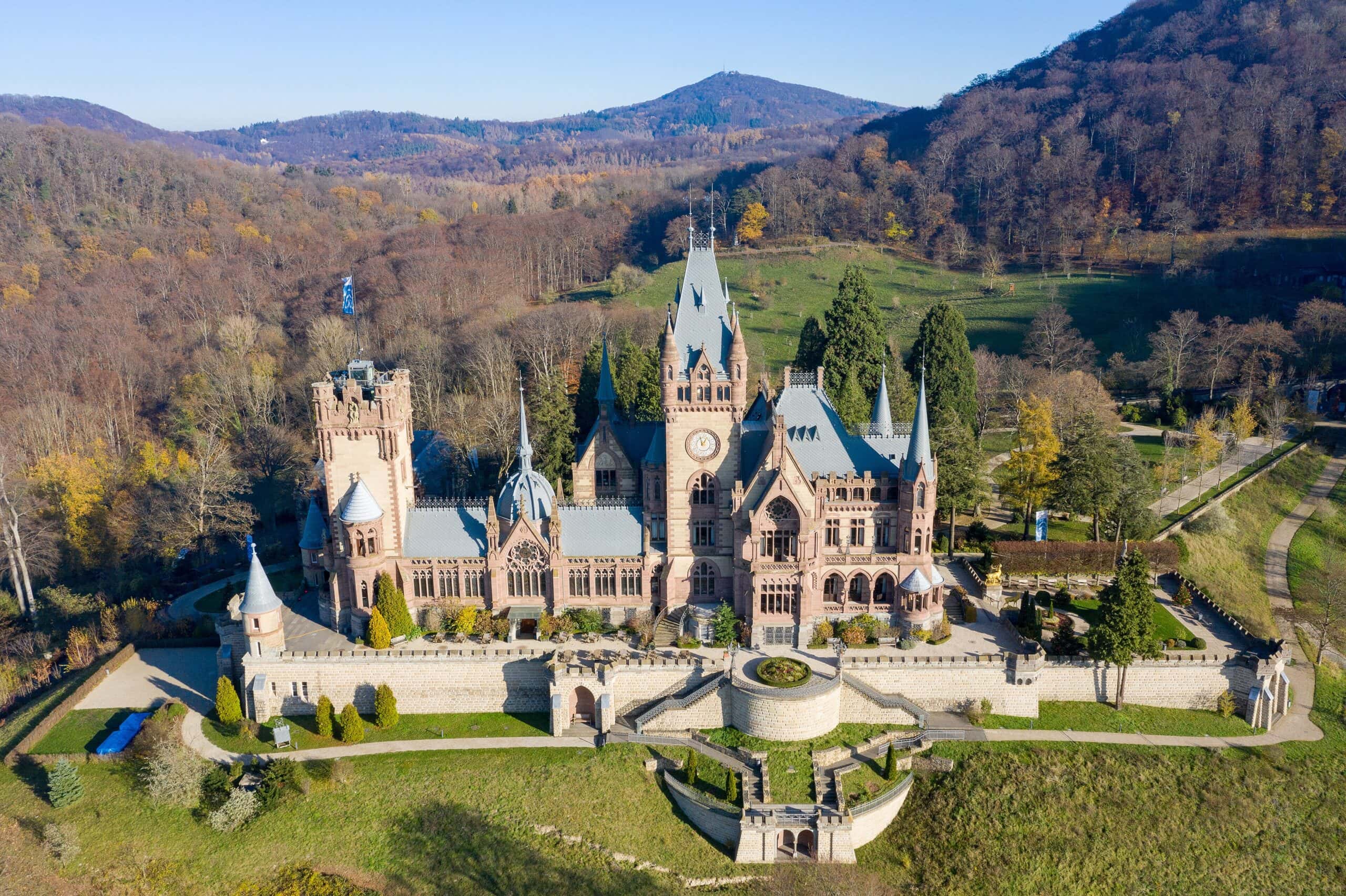 Drachenburg Castle 1 Aerial view of Schloss Drachenburg from the south showing the Neo-Gothic main building with the Siebengebirge hills behind