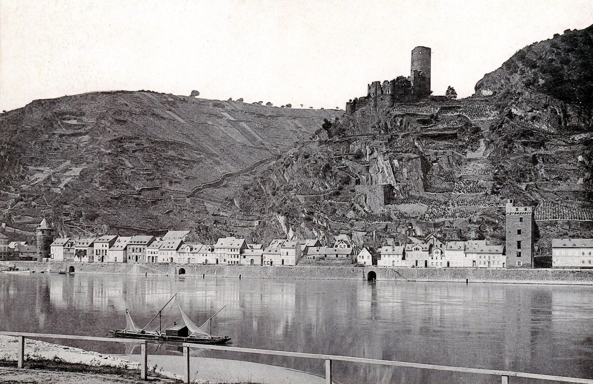 Katz Castle 5 1897 photograph of St. Goarshausen with the ruined Katz Castle on the hill above and a sailing barge on the Rhine