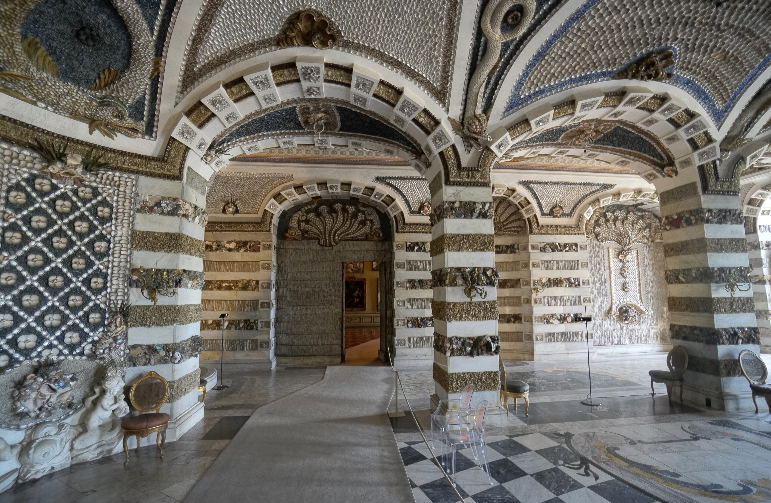 The Grotto Hall of the Neues Palais, its walls and pillars encrusted with shells, minerals, and semi-precious stones