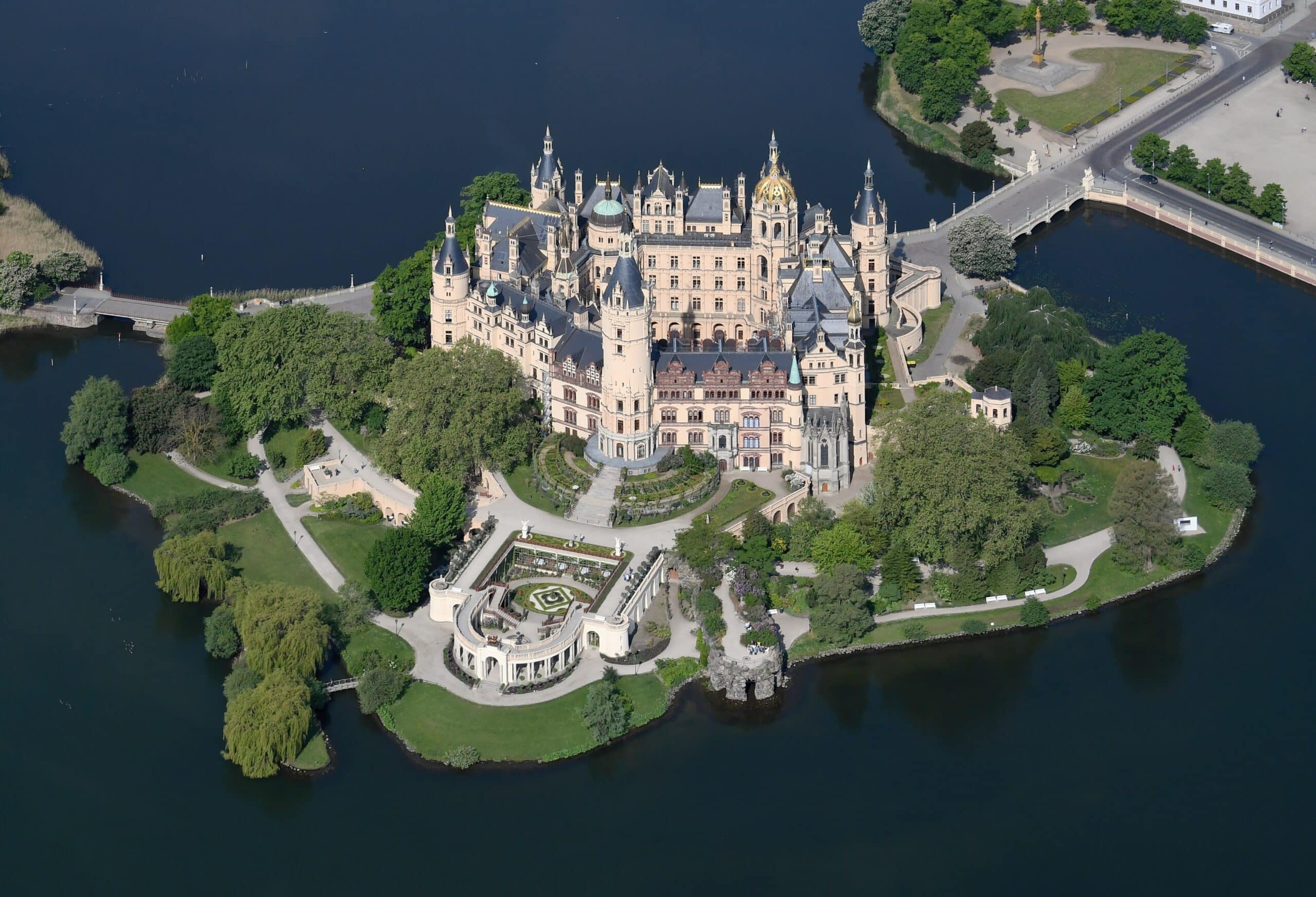 The 19th-Century Romantic Revival of German Castles 8 Aerial view of Schwerin Castle from the east, showing the multi-towered French Renaissance Revival silhouette on its island in Lake Schwerin.