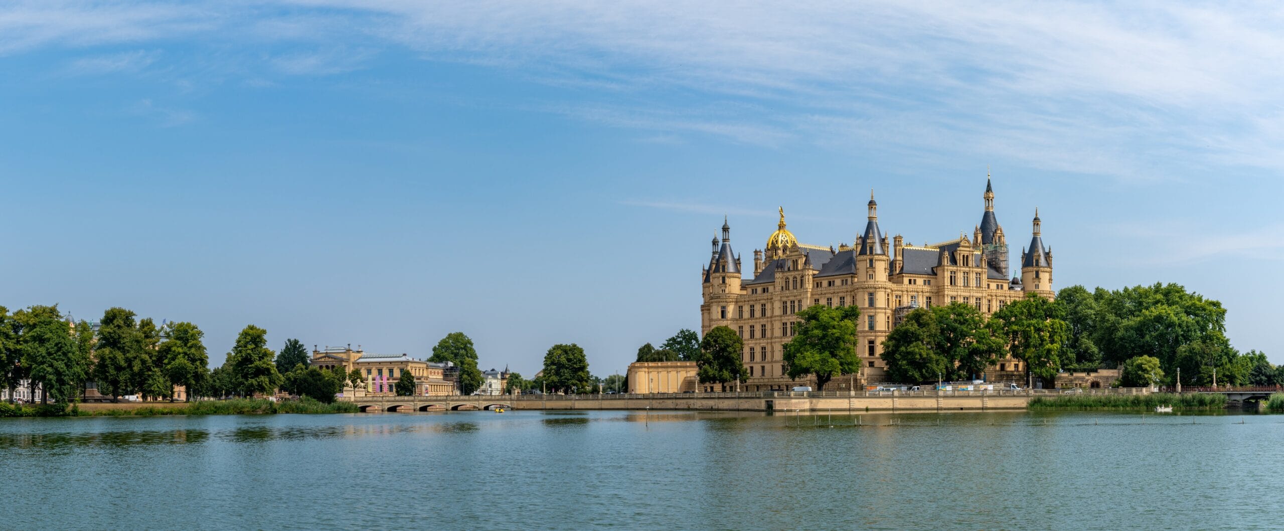 Schwerin Castle 1 Schwerin Castle, panoramic view across Lake Schwerin showing fifteen towers and the gilded dome