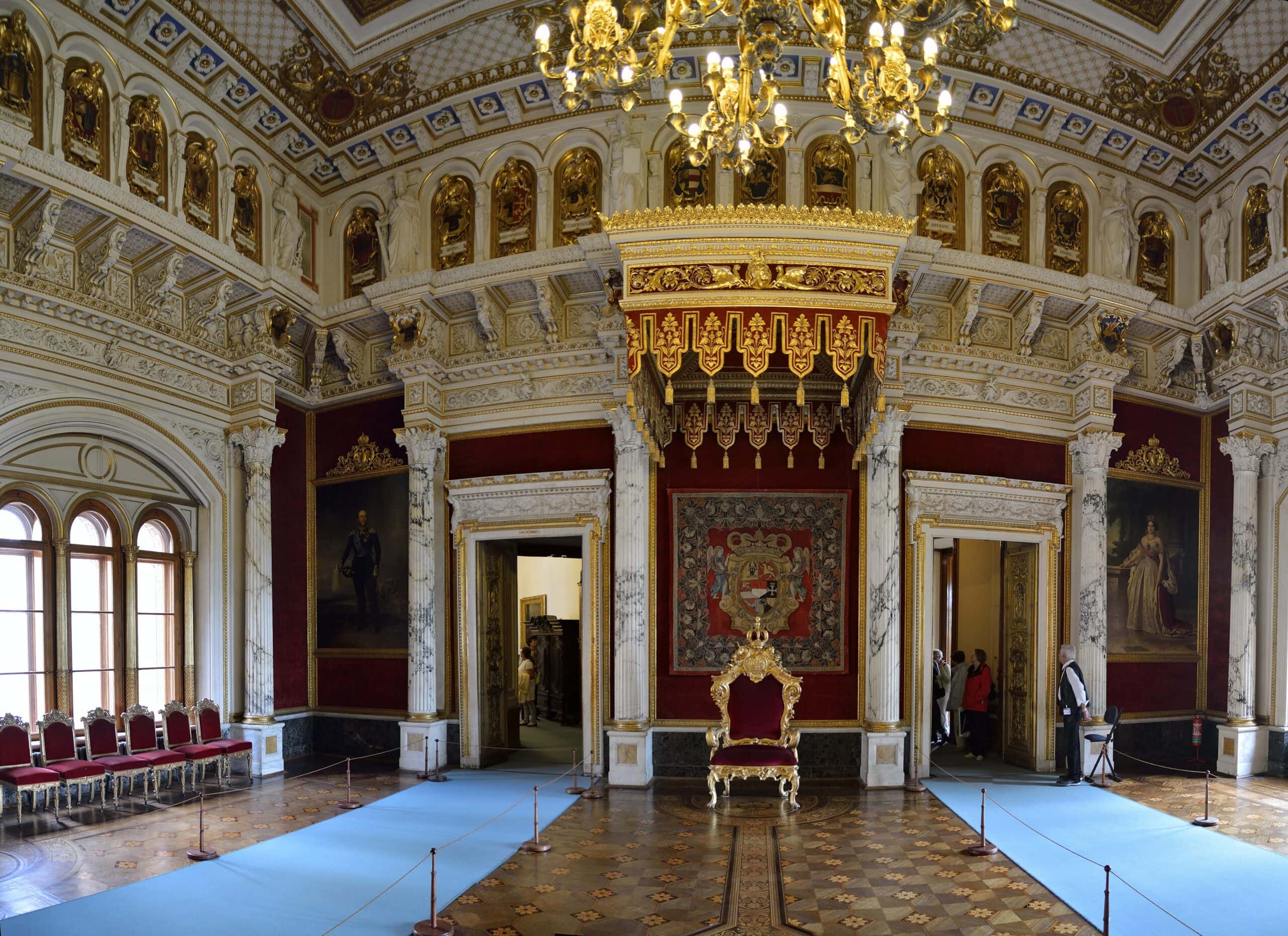 Schwerin Castle 7 Throne Room of Schwerin Castle, with white-and-gold neo-Renaissance ornament and the gilded throne beneath a red canopy