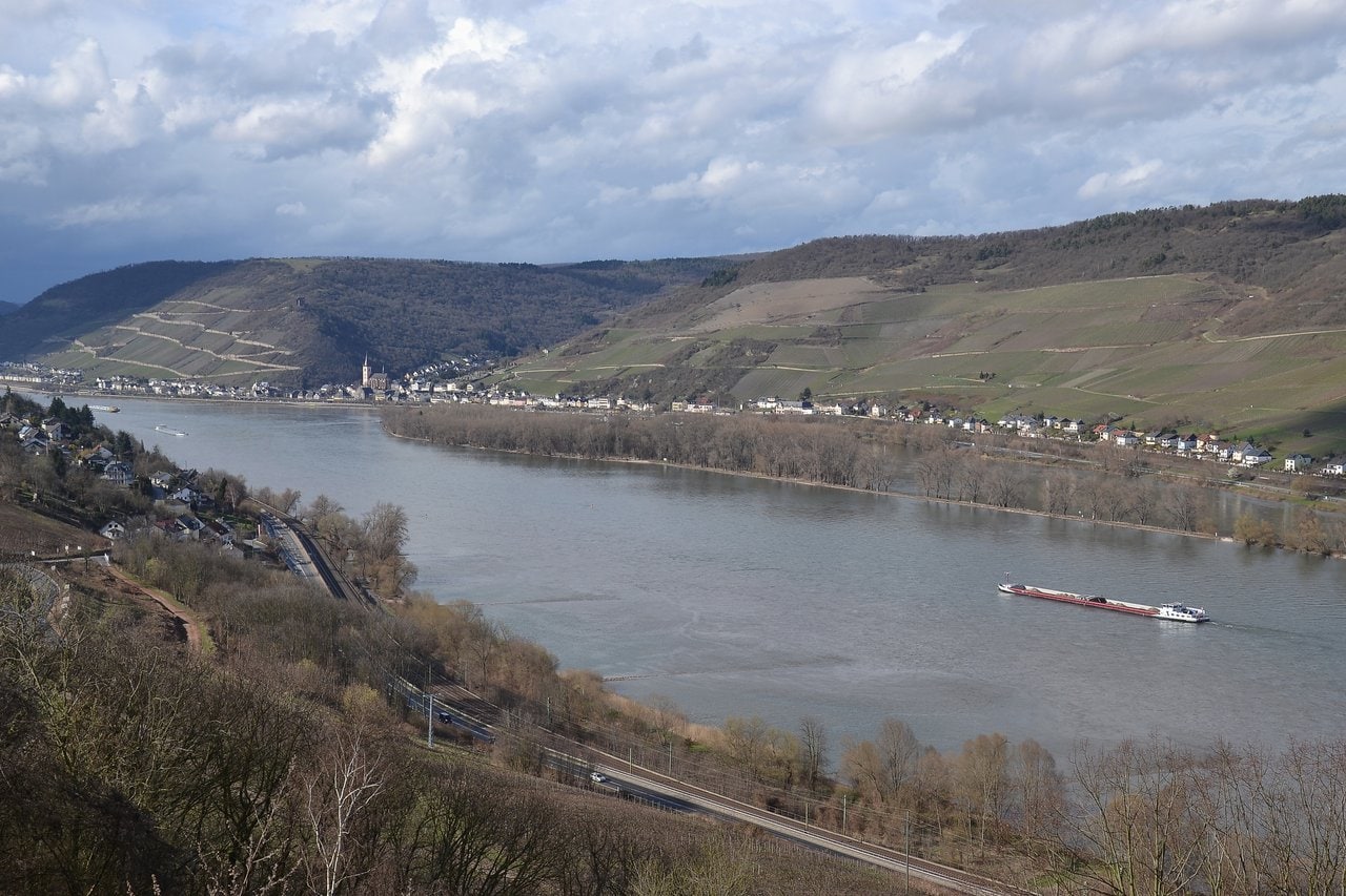 Sooneck Castle 6 Panoramic view of the Rhine valley as seen from Sooneck Castle, looking downstream toward Niederheimbach, with the river, railway, and vineyards visible.