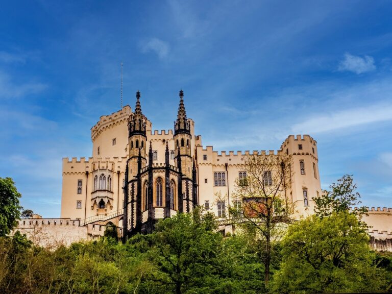 Stolzenfels Castle, a pale-yellow Gothic Revival summer palace, on a wooded ridge above the left bank of the Rhine near Koblenz.