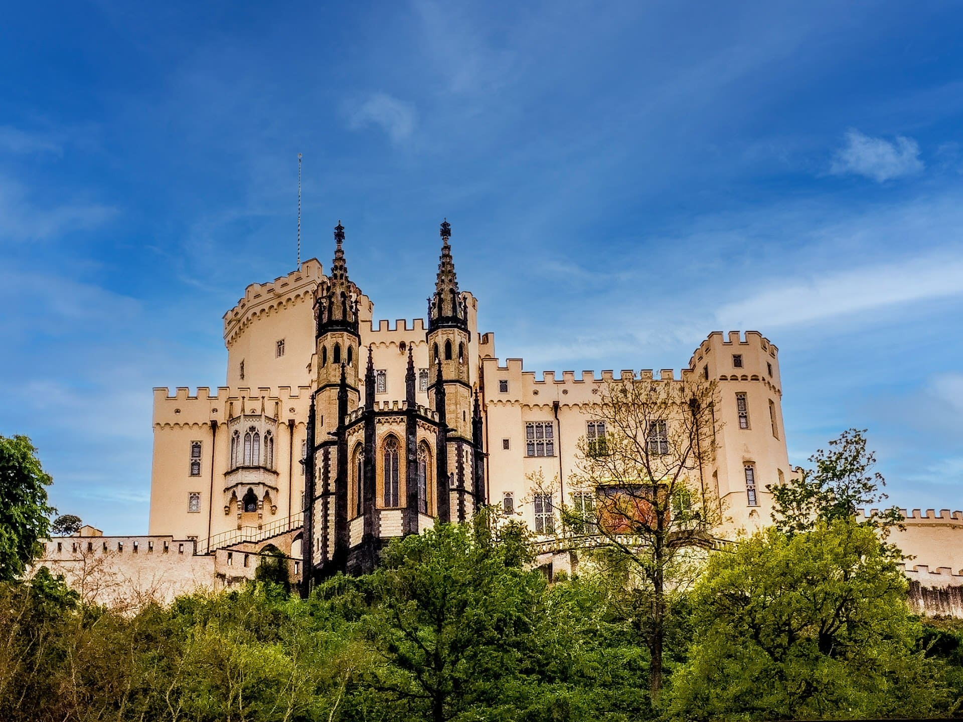 The 19th-Century Romantic Revival of German Castles 1 Stolzenfels Castle, a pale-yellow Gothic Revival summer palace, on a wooded ridge above the left bank of the Rhine near Koblenz.