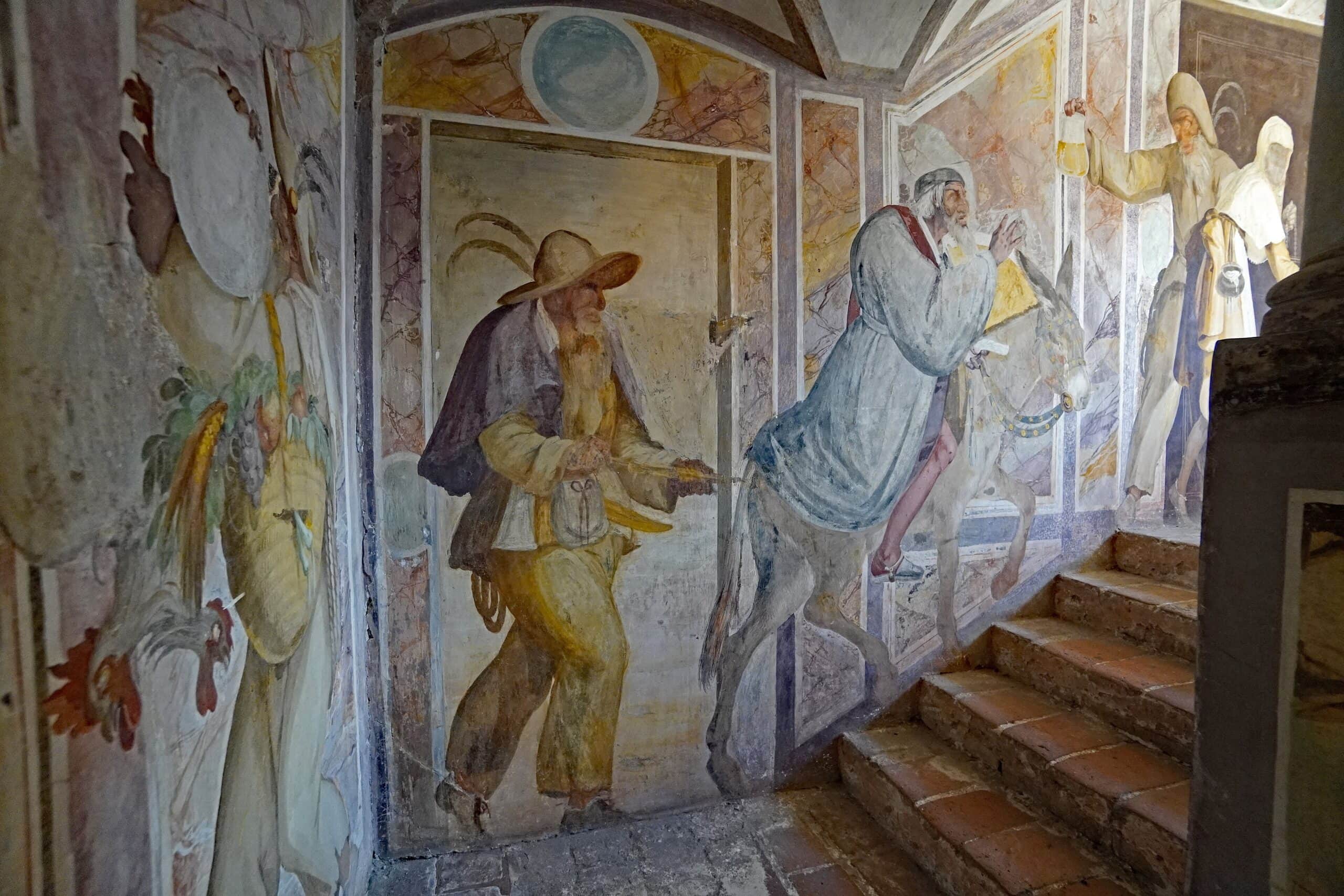 Trausnitz Castle 5 Narrentreppe (Fool's Staircase) frescoes showing Pantalone with broad hat and Zanni on a donkey