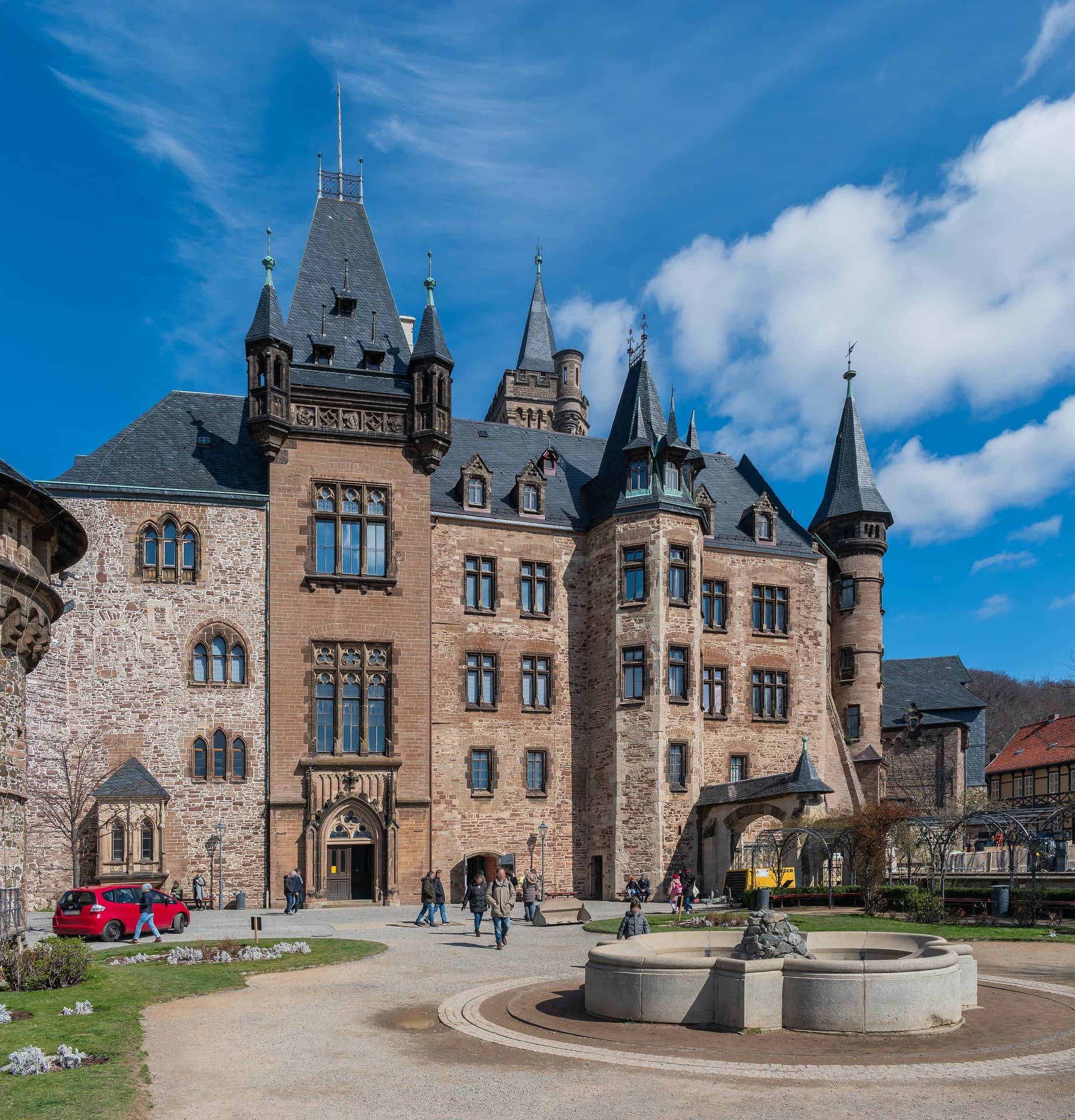 Wernigerode Castle 3 Carl Frühling's historicist west front of Wernigerode Castle with fountain in the inner courtyard