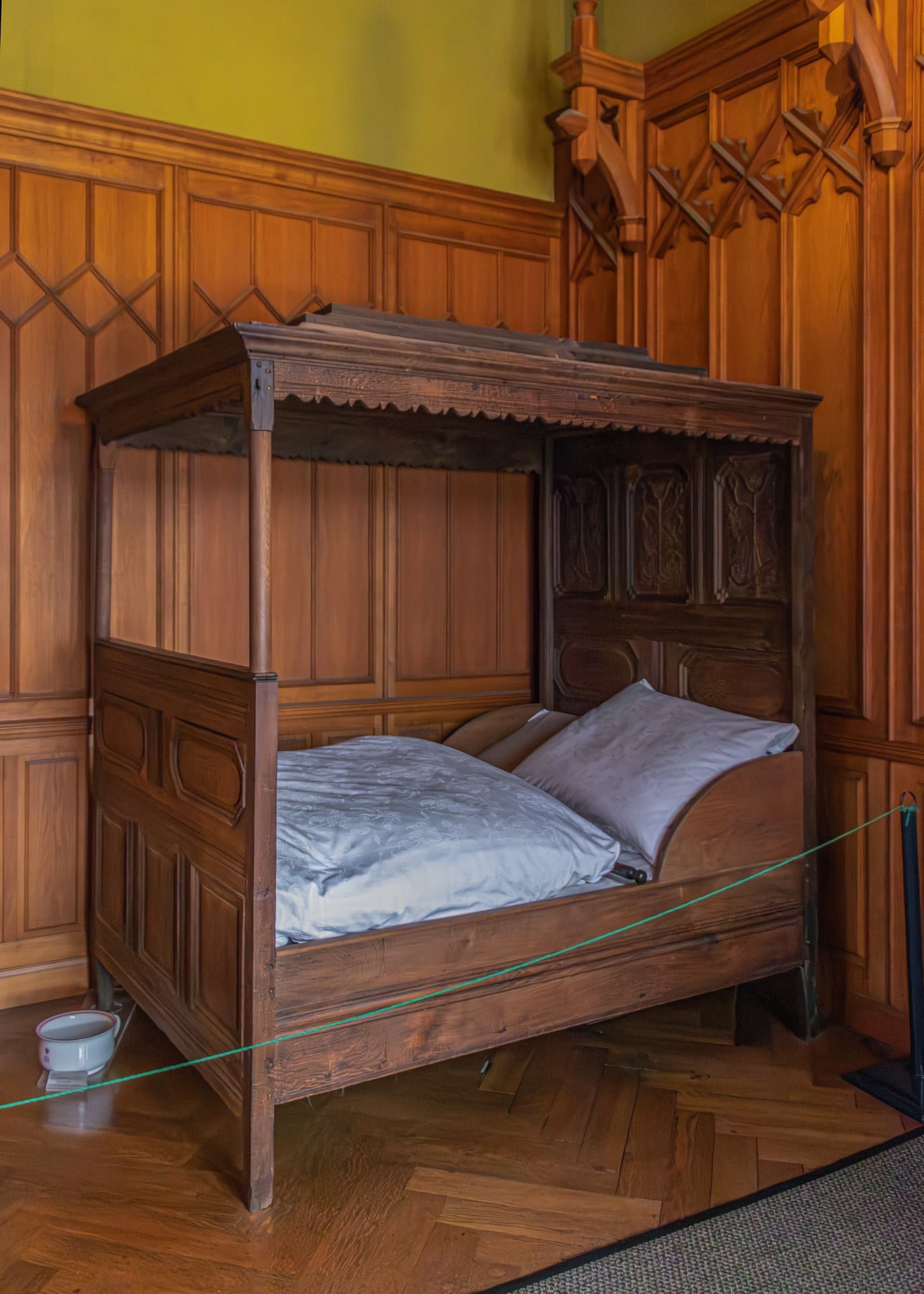 Wernigerode Castle 5 Wood-paneled bedroom in Wernigerode Castle with Gothic-revival carved four-poster bed