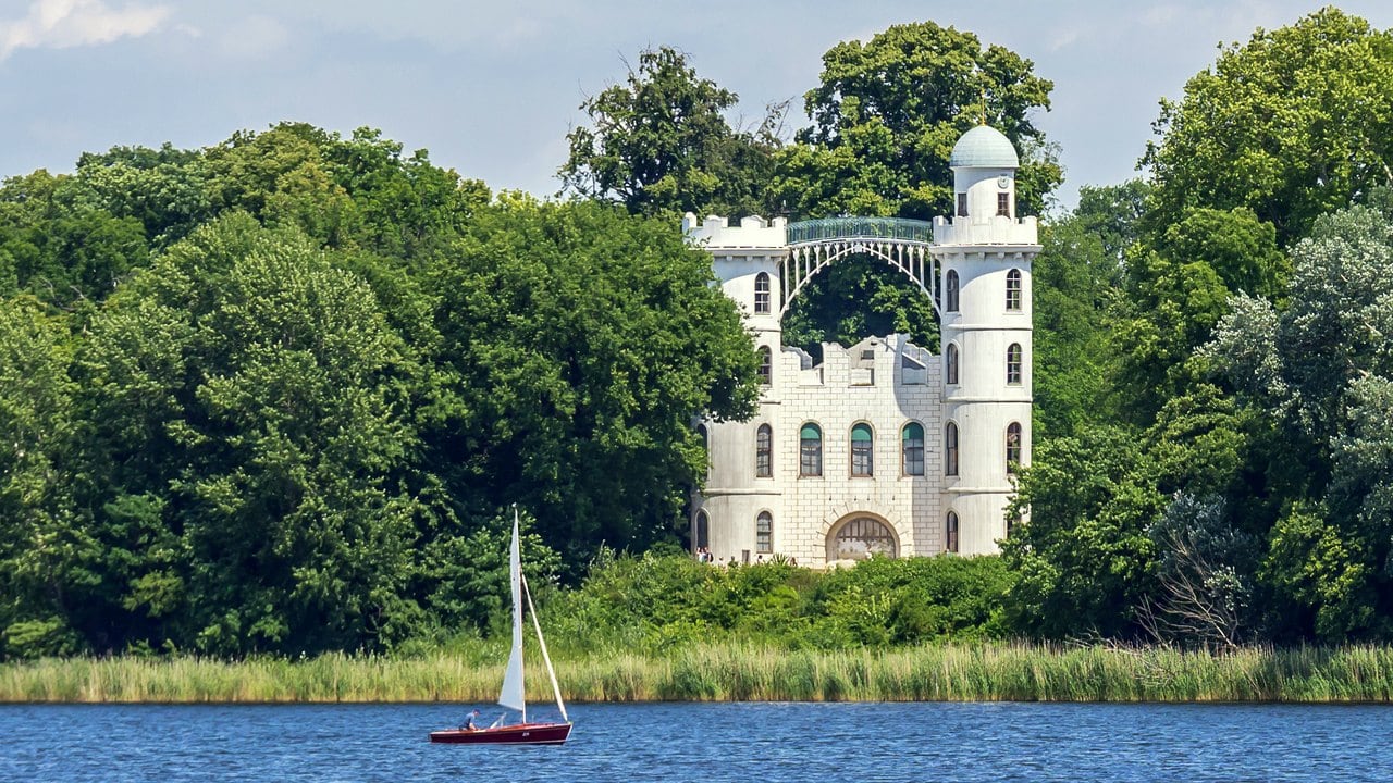 Pfaueninsel Palace 2 Pfaueninsel Palace seen across the Havel with a sailing boat