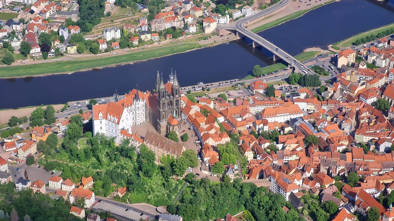 Castles of Saxony 5 Albrechtsburg castle and Meissen Cathedral sharing the Burgberg rock above the Elbe, seen from the air.