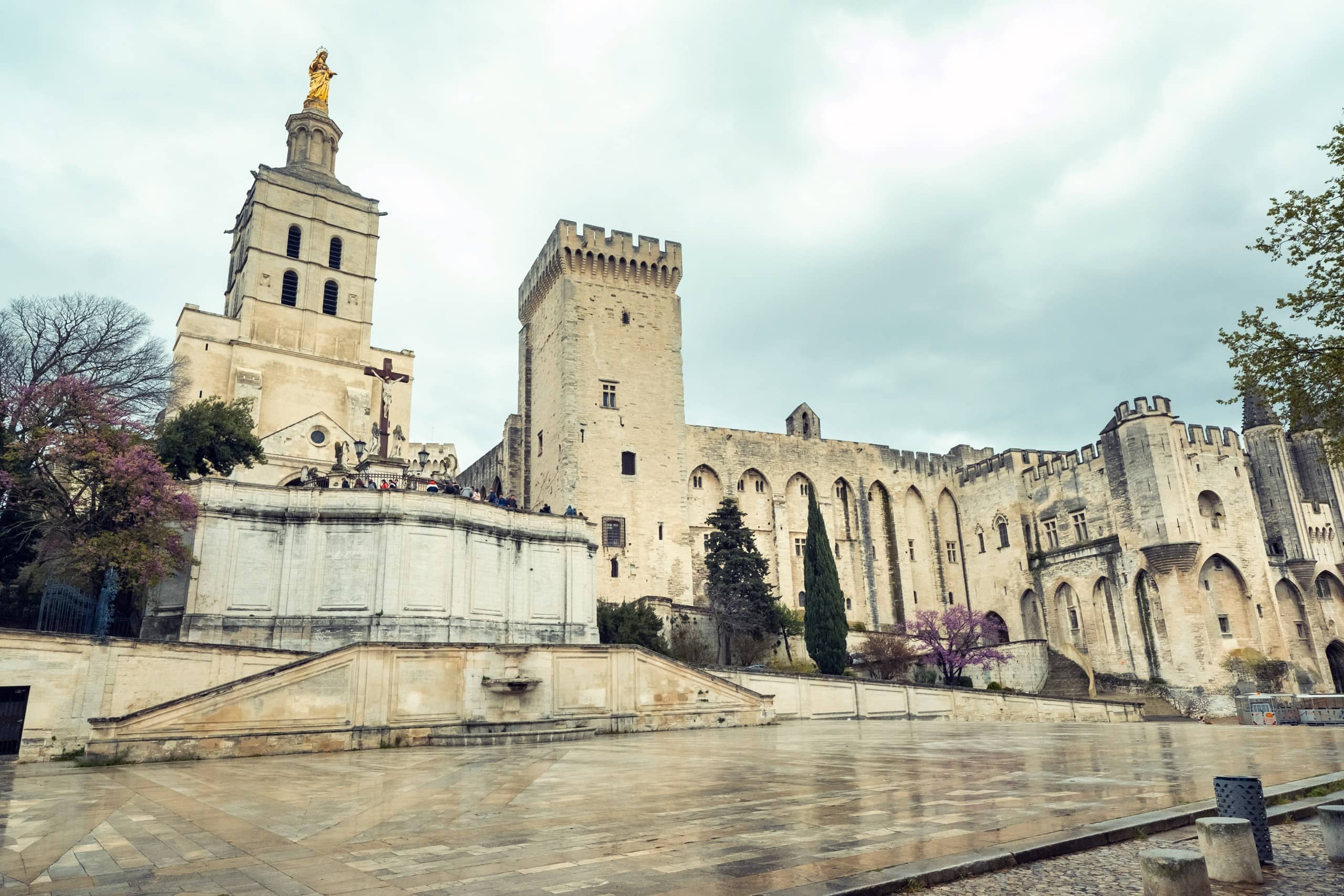 Avignon Cathedral and the Palais des Papes The gilded Virgin atop Avignon Cathedral beside the towers of the Palais des Papes