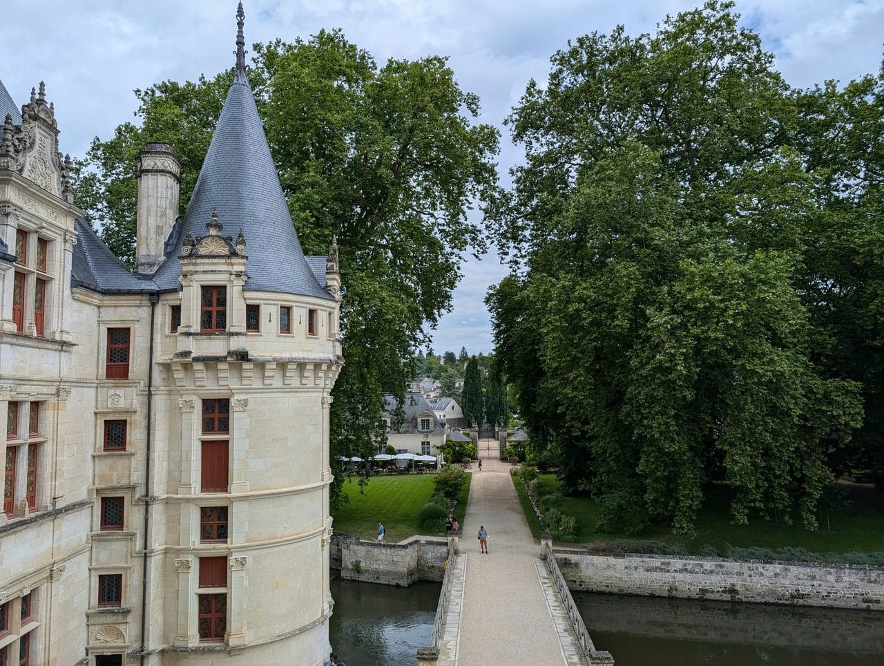 From the corner tower over the bridge — Carnet de Voyage d'Alex, Unsplash View from Château d'Azay-le-Rideau past a corner tower down the entrance bridge