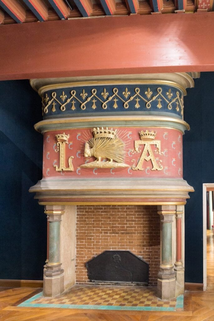 Château de Blois 15 Louis XII's crowned porcupine emblem on a restored fireplace at Château de Blois