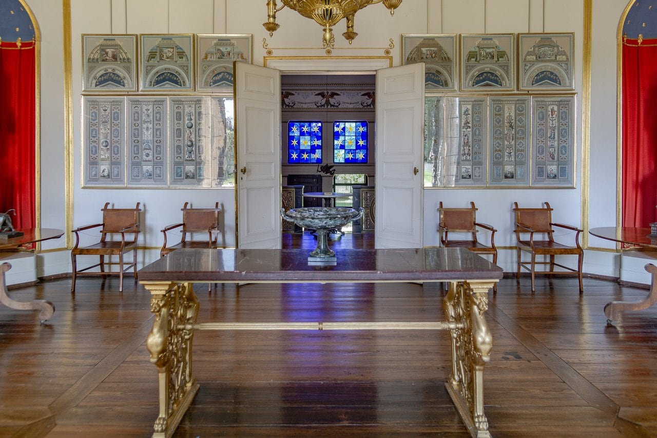 Charlottenhof Palace 4 The hall at Charlottenhof Palace with its gilded table and the star windows of the vestibule beyond