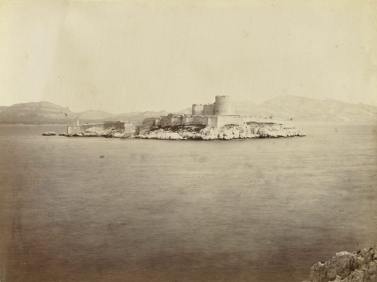 Antique photograph of Château d'If on its island in the Bay of Marseille.