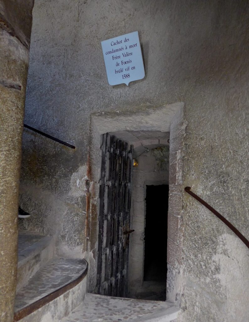 Door of a prison cell at Château d'If, carved with prisoners' graffiti.