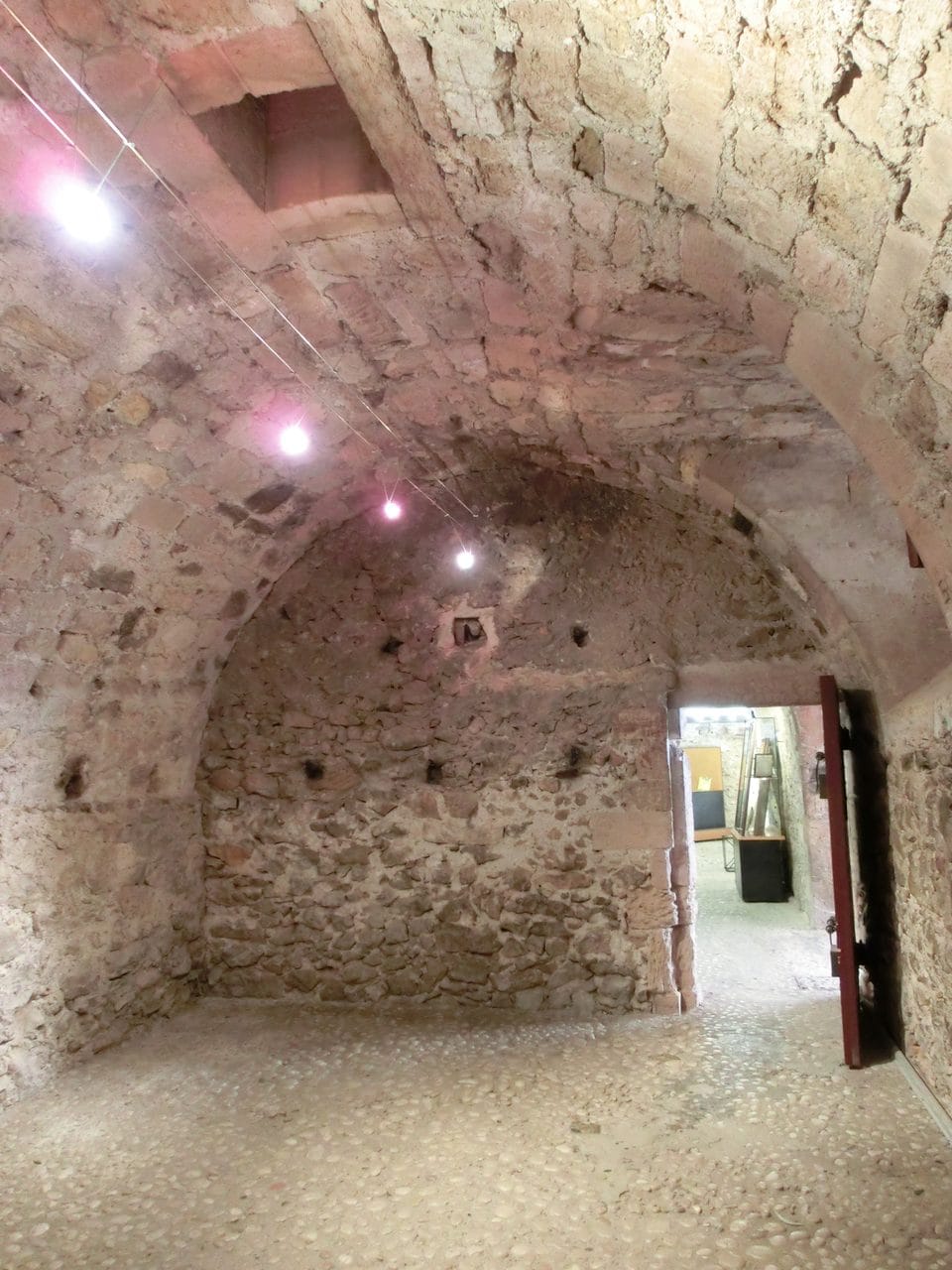 Bare vaulted stone cell at Château d'If presented as the cell of Edmond Dantès.