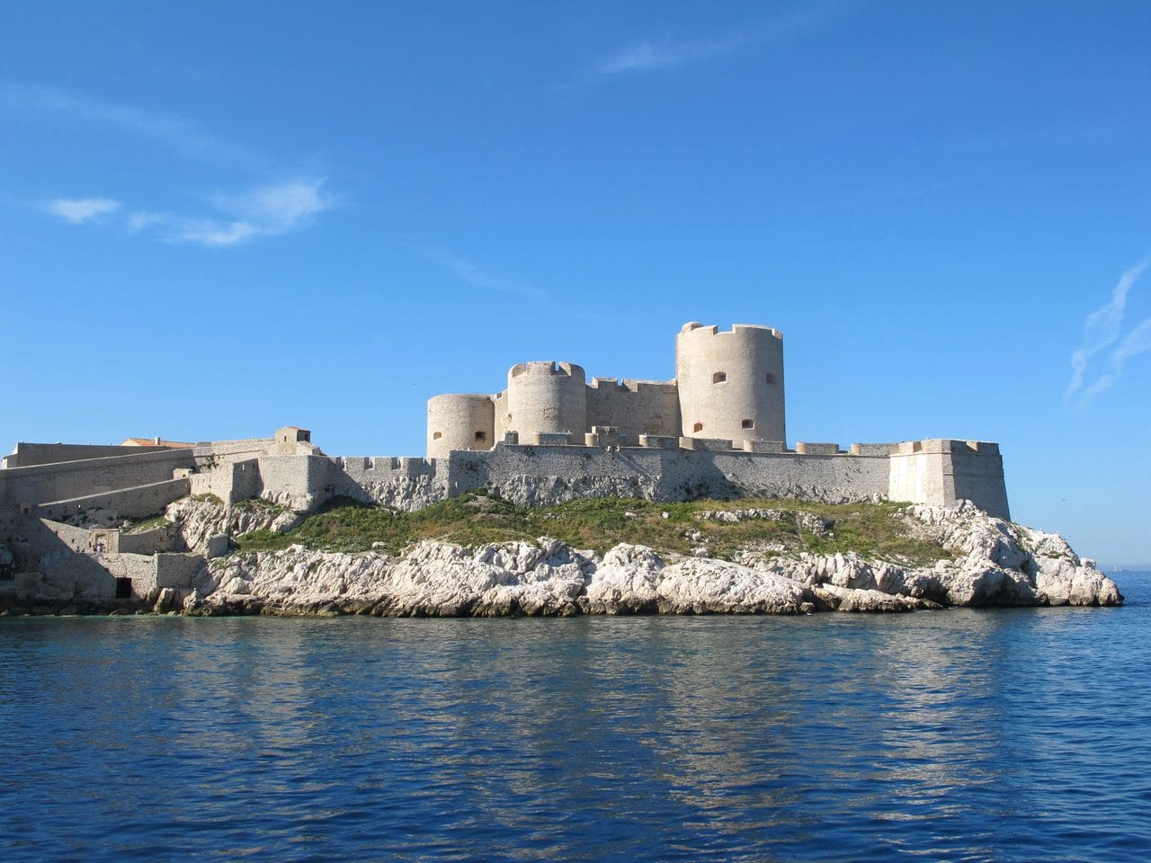 Château d'If, an island fortress of three round towers, seen across the sea near Marseille.