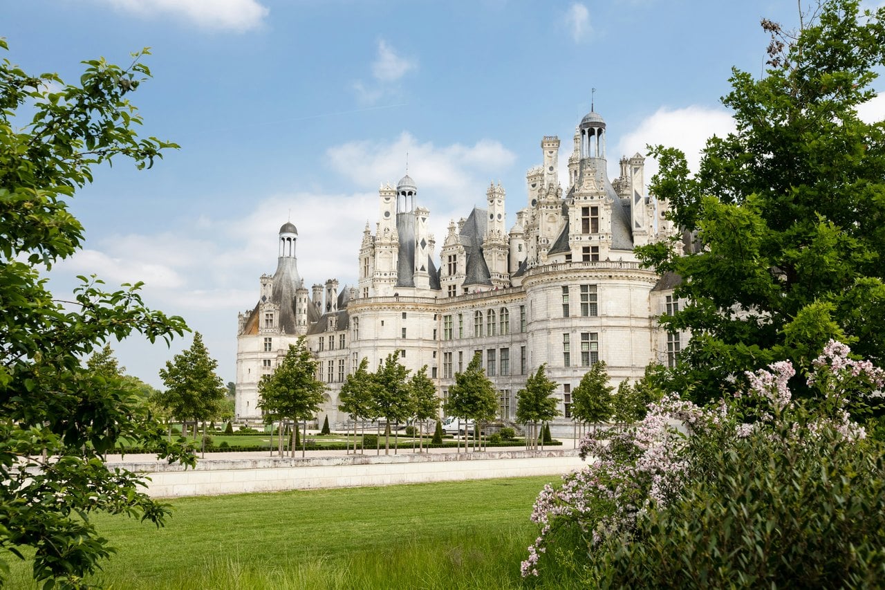 Across the spring gardens — Dorian Mongel / Unsplash Chateau de Chambord seen across spring gardens