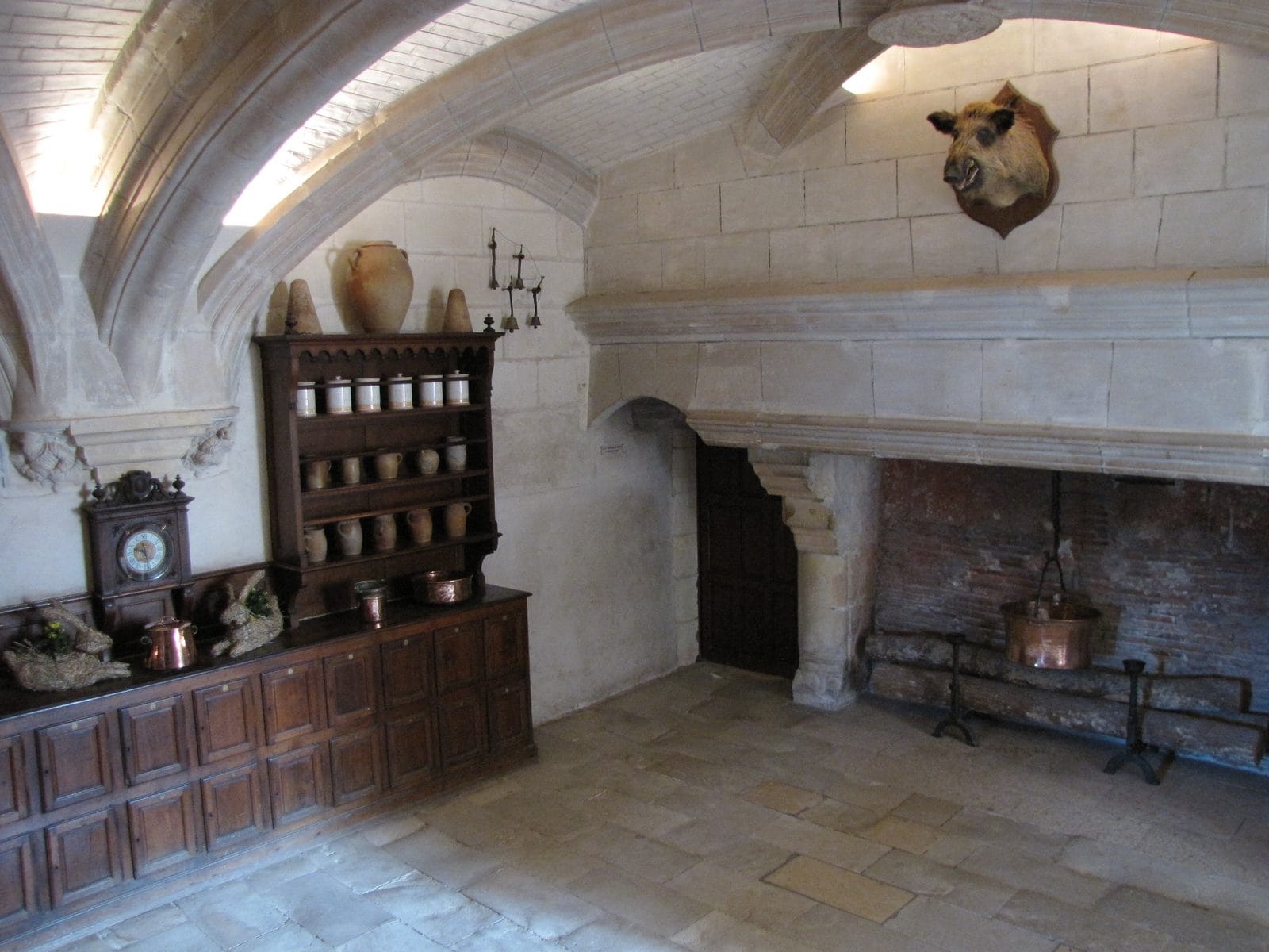 Château de Chenonceau 9 The vaulted kitchens of Chateau de Chenonceau in the bridge piers with copper pans and a great fireplace