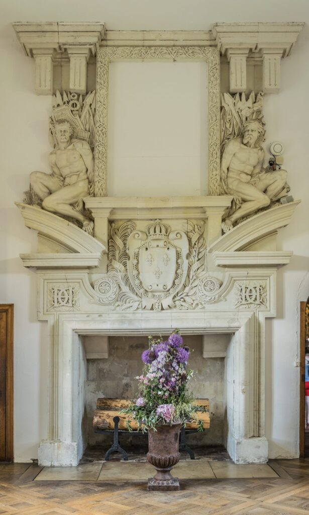 Château de Chenonceau 13 Monumental Renaissance fireplace with telamones and royal arms at Chateau de Chenonceau