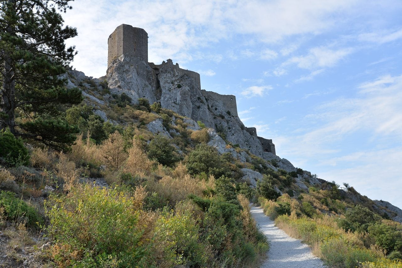 Path climbing to Château de Quéribus on its rocky spur near Cucugnan