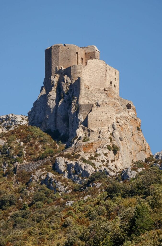 Château de Quéribus keep standing on its rock against a blue sky