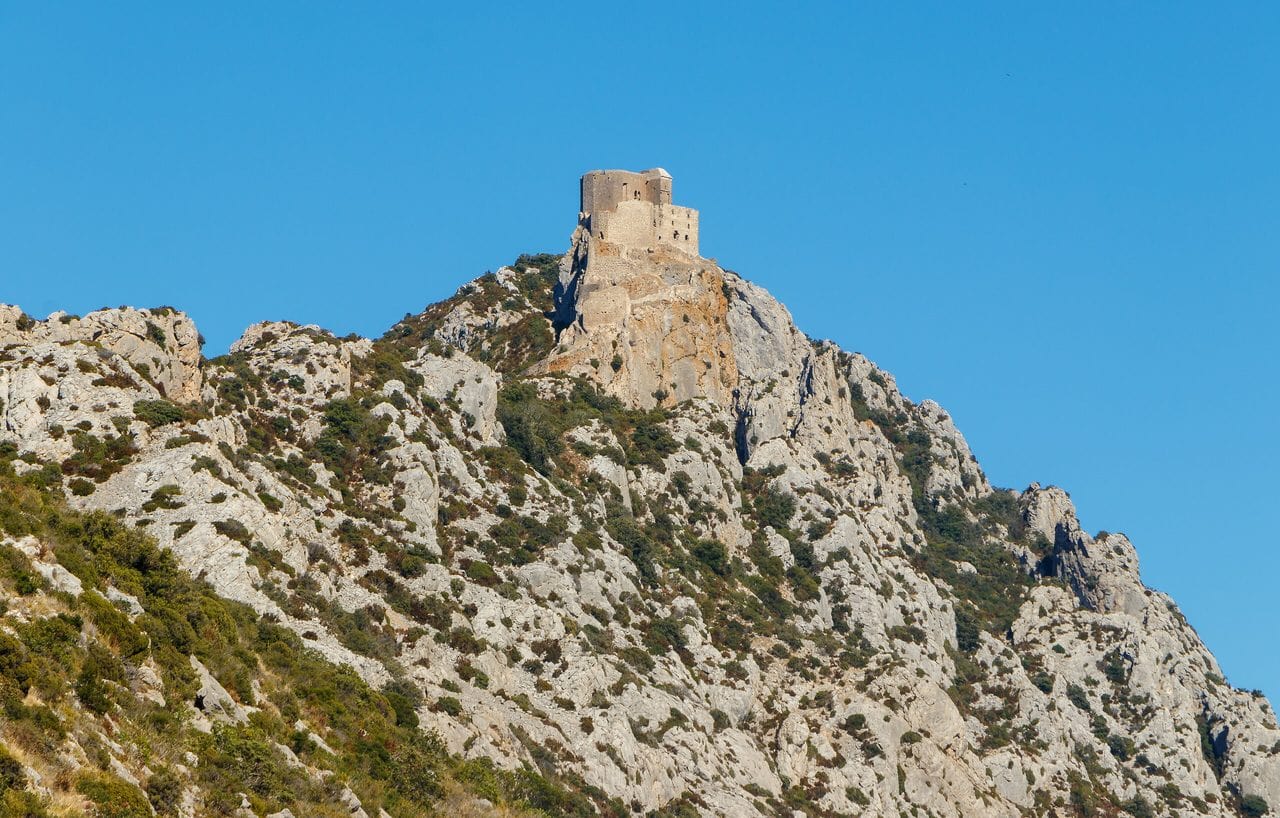 Château de Quéribus seen from a distance on its limestone ridge
