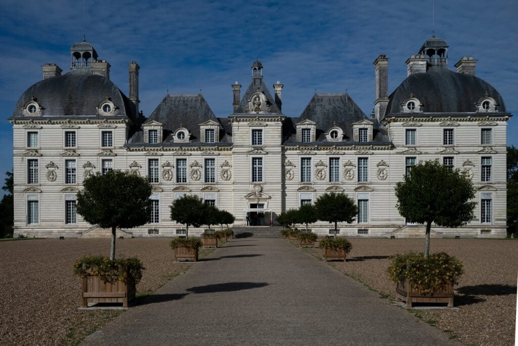 Château de Cheverny 12 Front of Château de Cheverny with potted orange trees under a moody sky