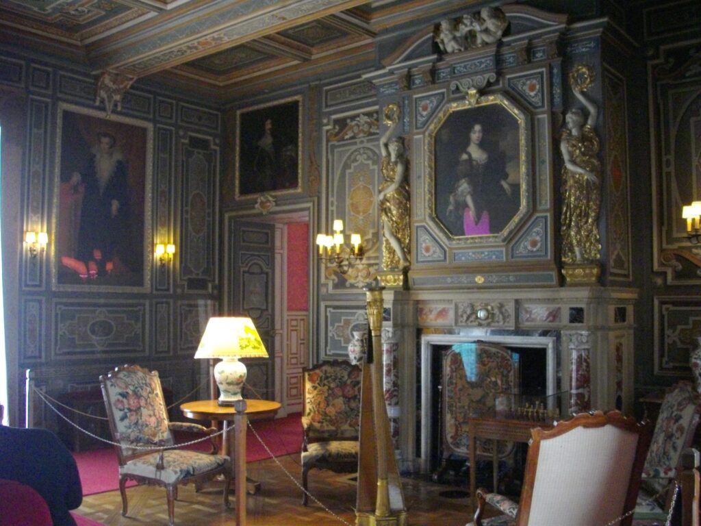 Château de Cheverny 15 Grand Salon fireplace at Cheverny with gilded caryatids flanking a portrait
