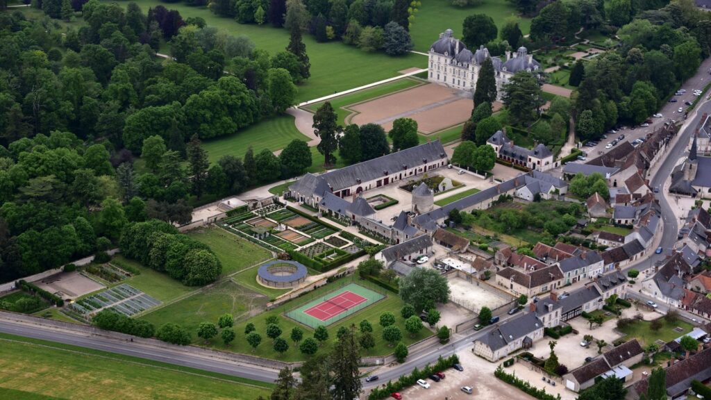 Château de Cheverny 18 Aerial view of the Cheverny estate showing the chateau, outbuildings, kitchen gardens, and village