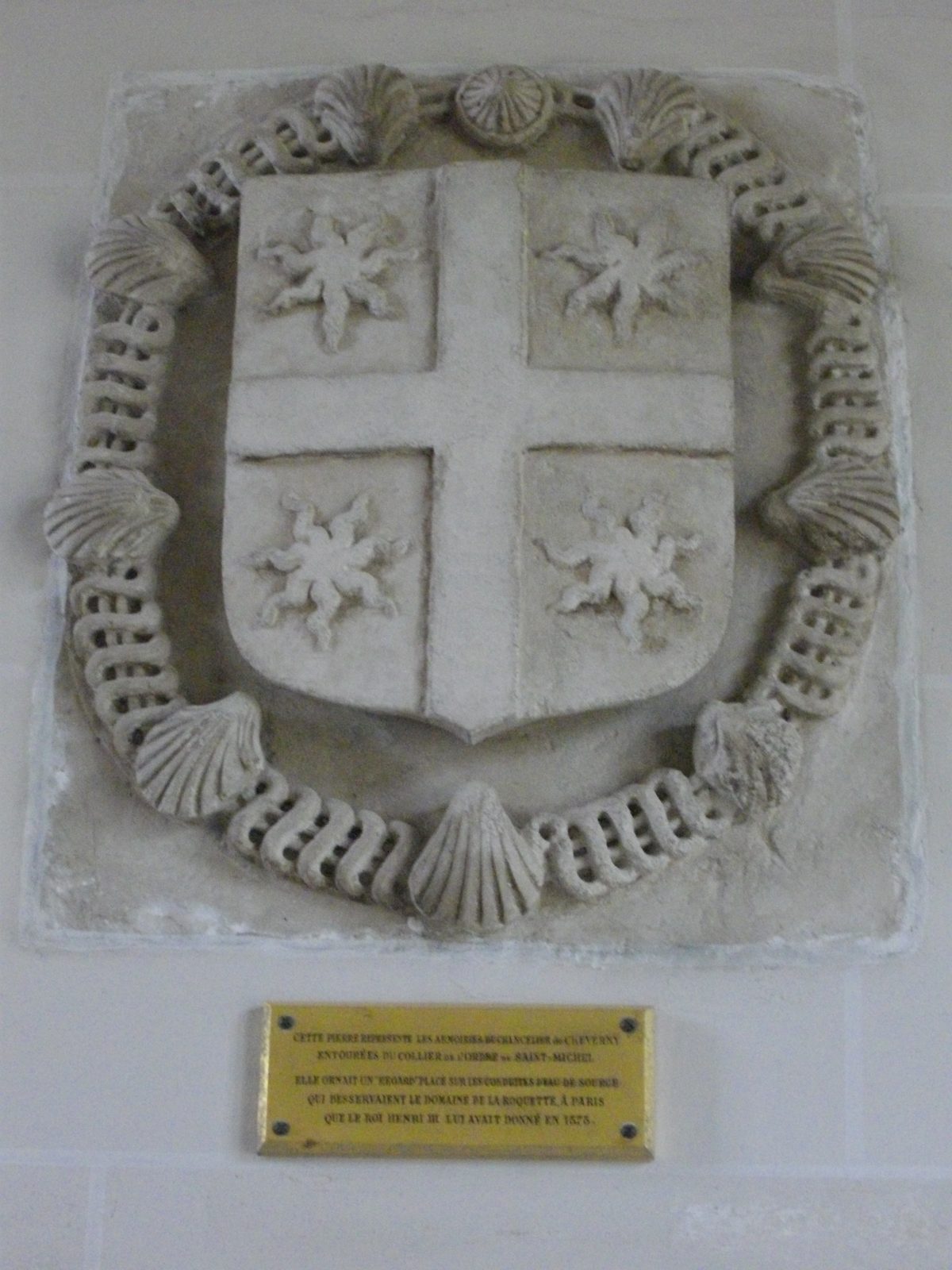 Château de Cheverny 3 Carved stone arms of Chancellor Philippe Hurault de Cheverny encircled by the collar of the Order of Saint-Michel