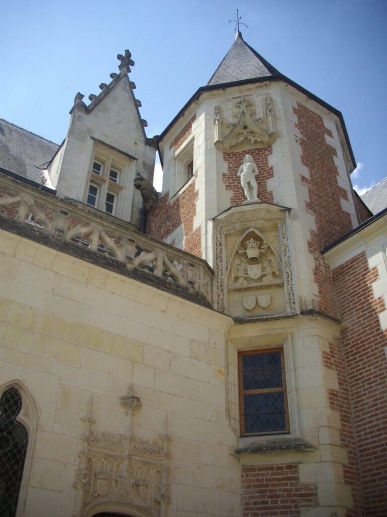 Château du Clos Lucé 16 Watchtower of Clos Lucé with statue niche and carved arms above the chapel corner