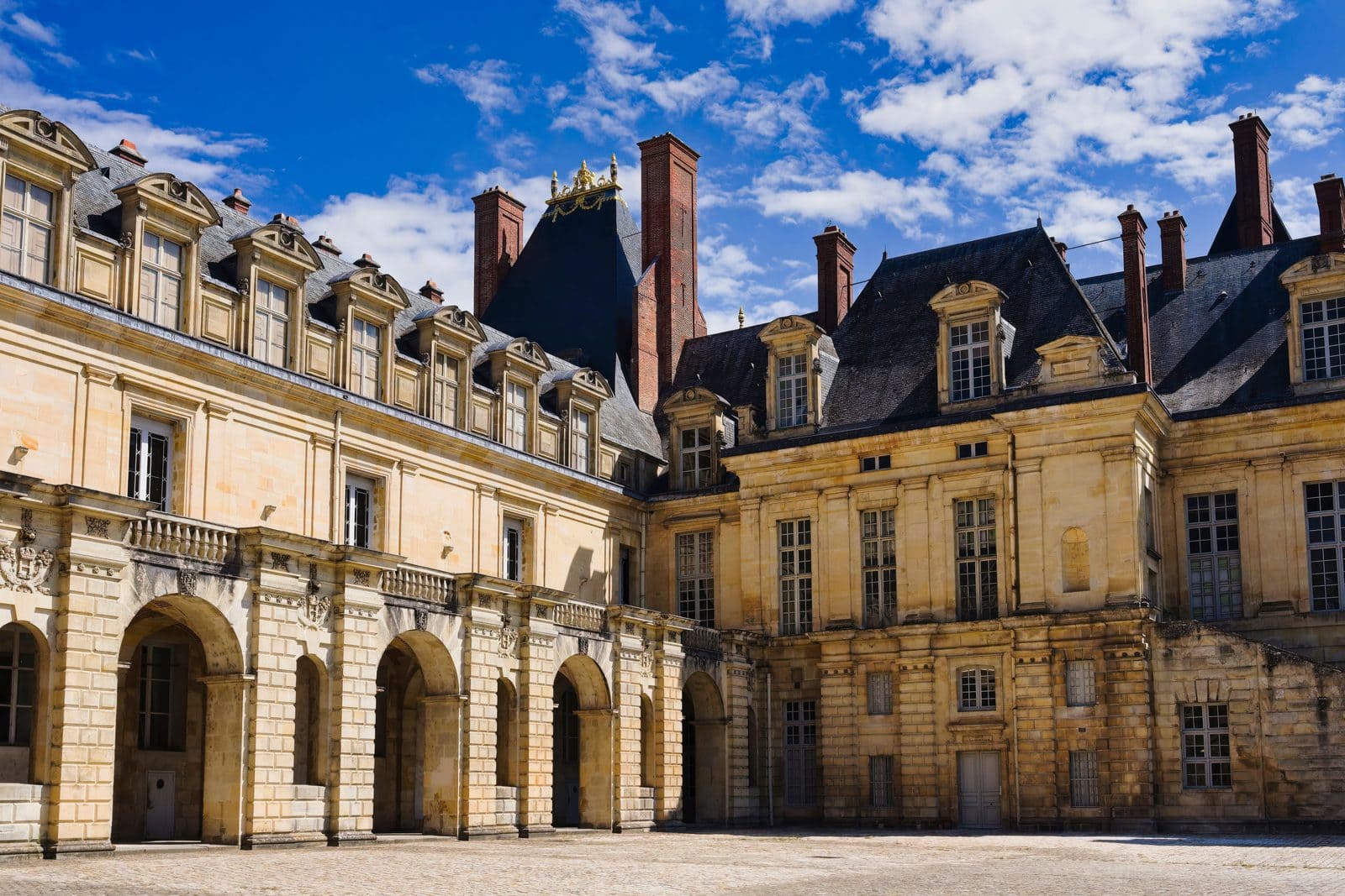 Château de Fontainebleau 1 The main facade of the Château de Fontainebleau seen across the Cour du Cheval Blanc