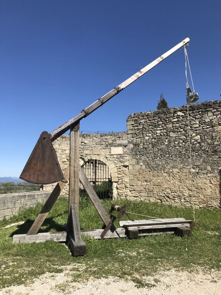 A modern reconstruction of a trebuchet displayed at Fort Saint-André.