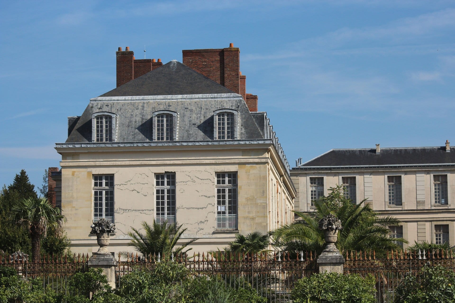 Castle Hotels Near Paris: Where You Can Actually Sleep in a Château 1 Castle hotels near Paris: Le Grand Contrôle, the Airelles hotel on the Palace of Versailles estate, seen from the Orangerie parterre