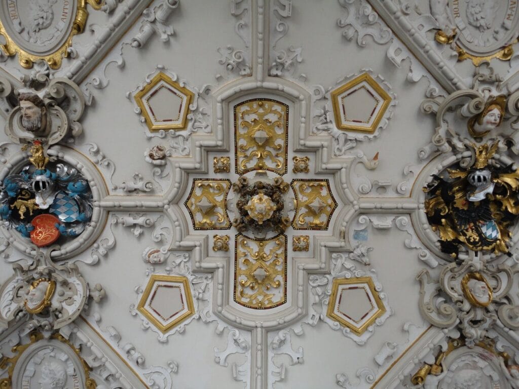 Ornate gilded ceiling in the restored Friedrichsbau interior at Heidelberg Castle