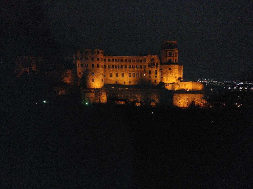 Heidelberg Castle and the Old Bridge floodlit above the Neckar at night